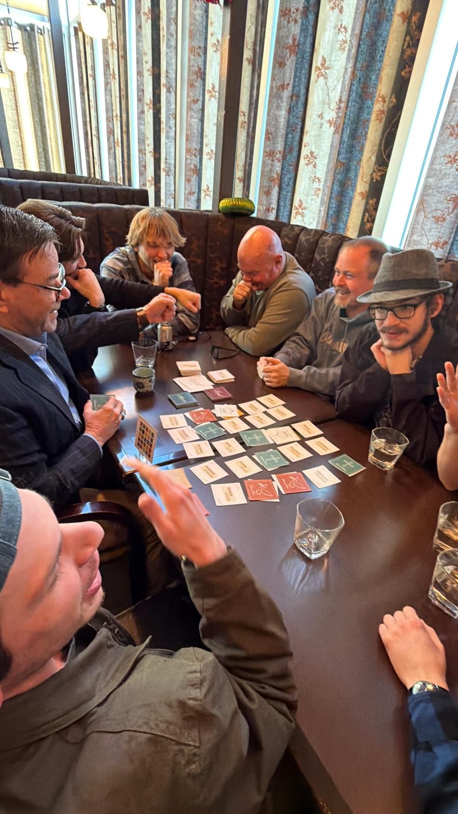 Group of friends playing Revival around a table
